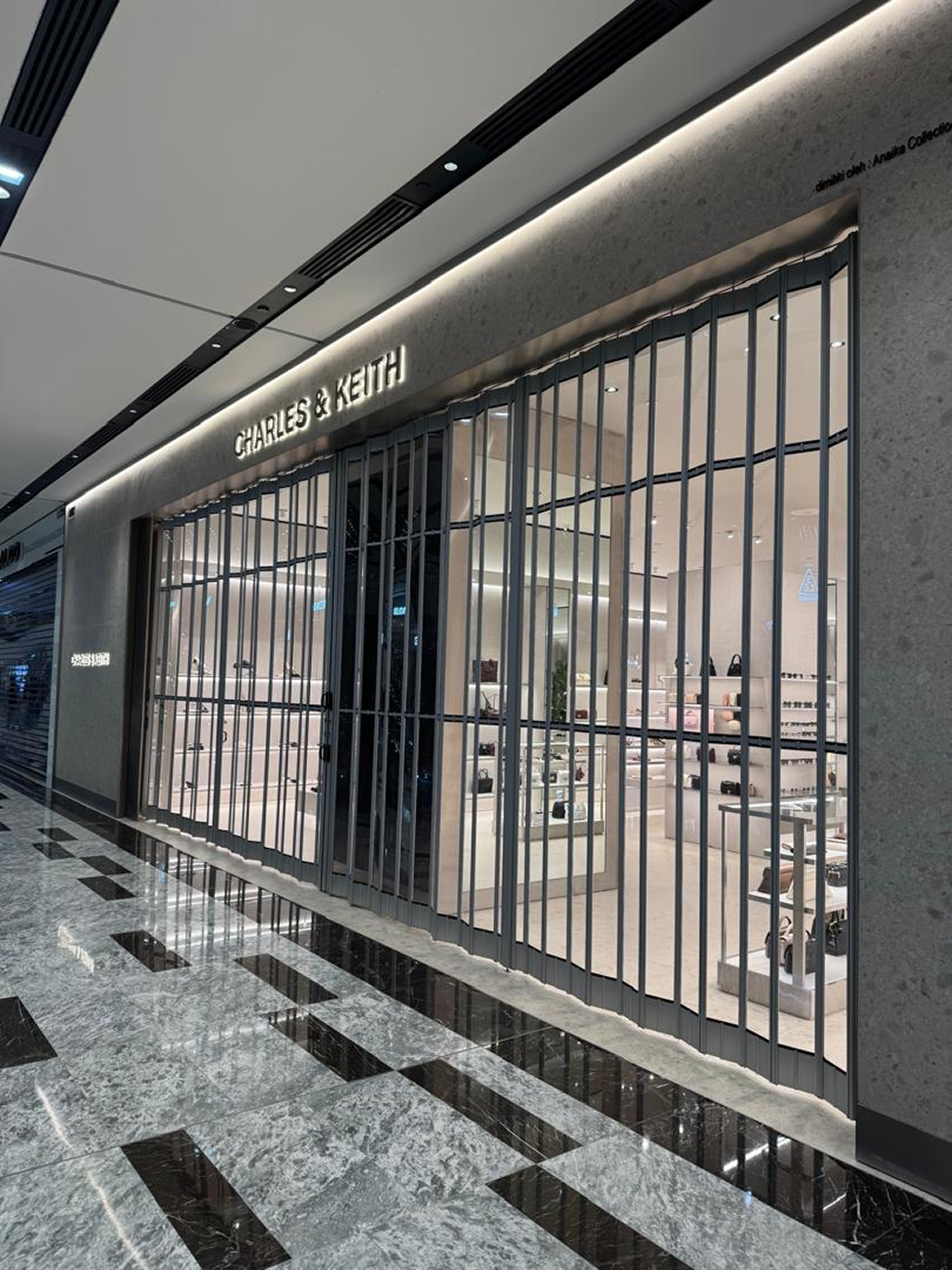 Folding glass door installation at Charles & Keith retail store Malaysia