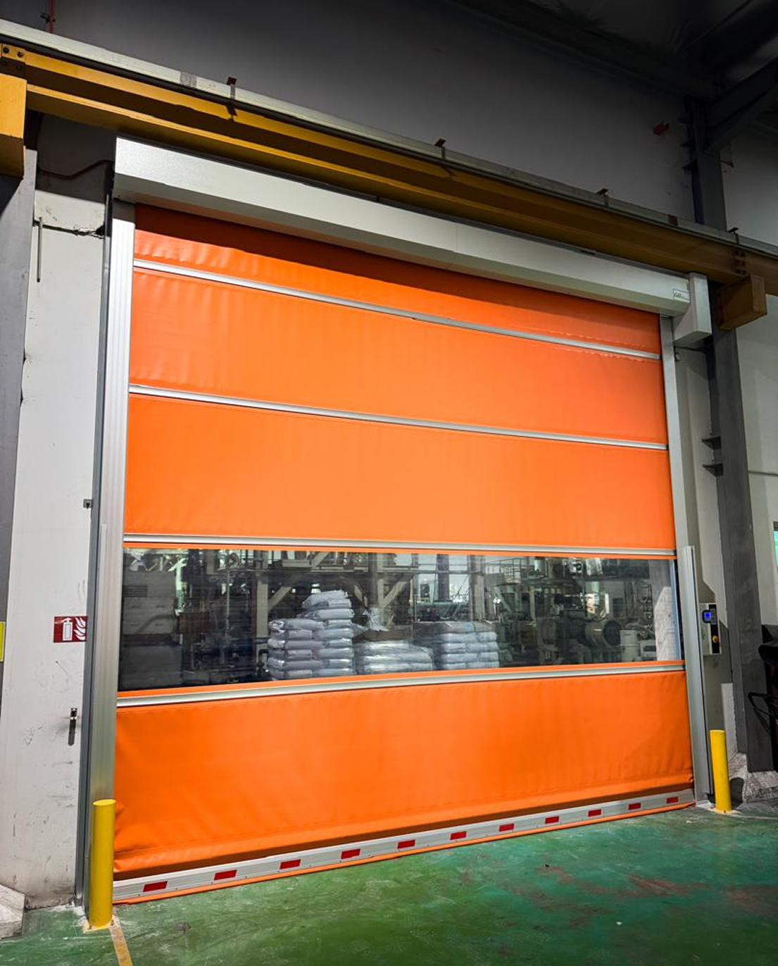 Industrial high-speed door installation at Scientex manufacturing facility in Malaysia